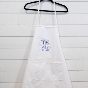 White apron with a blue text design hanging on a black hanger.