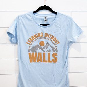 Light blue T-shirt with outdoor-themed graphic and text.