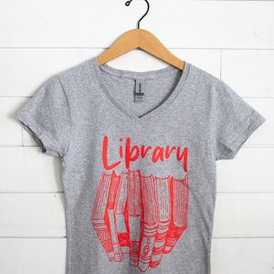 Gray t-shirt with red text and book graphic.