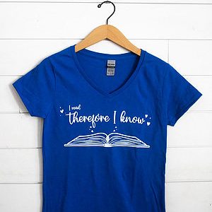 Blue T-shirt with a book and inspirational quote design.