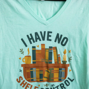 T-shirt with bookshelf and humorous quote.